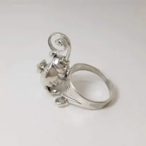 Arabella ring shown from the side, highlighting its sculptural spiral and polished organic forms.