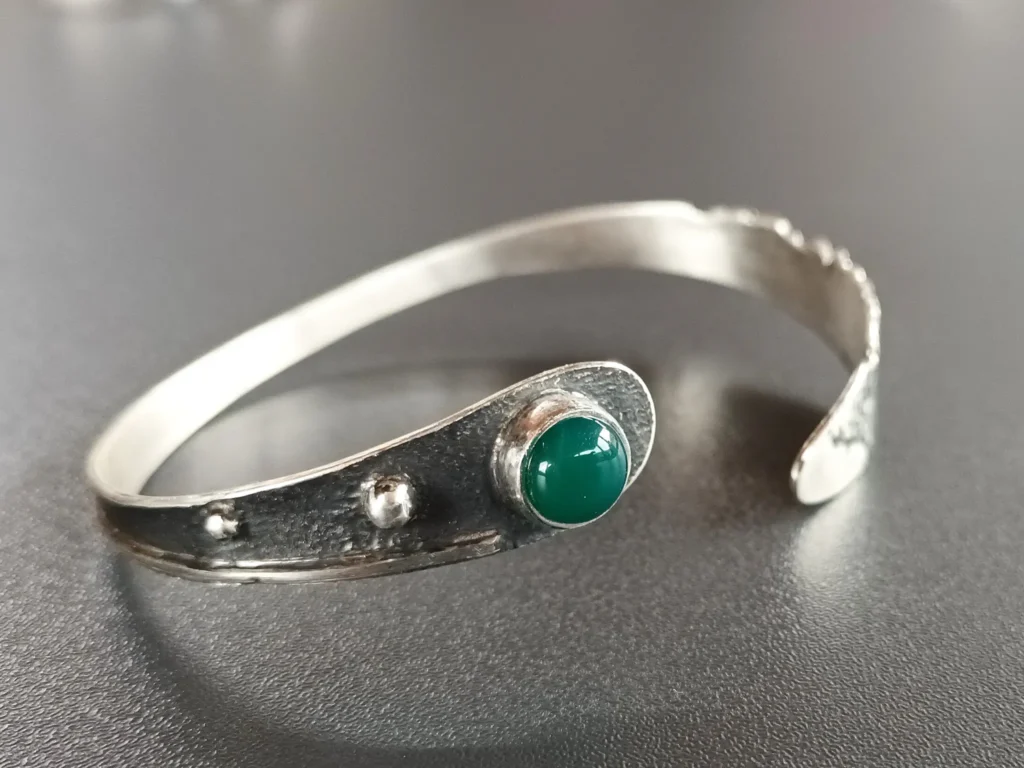 Three-quarter angle of the handmade sterling silver Still Point bracelet