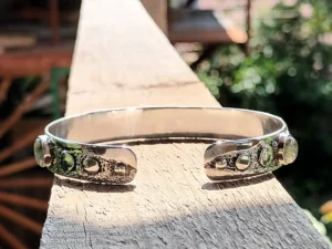 Back view of the Gathered handcrafted sterling silver bracelet showing the polished inner band and handcrafted construction.