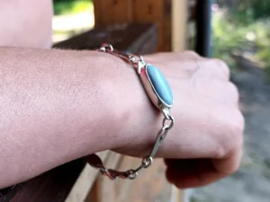 Ophelia contemporary sterling silver bracelet worn on the hand.