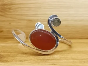 Front view of the Last Light contemporary sterling silver bracelet with carnelian.