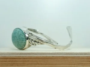Angled side view of the Between contemporary sterling silver bracelet.