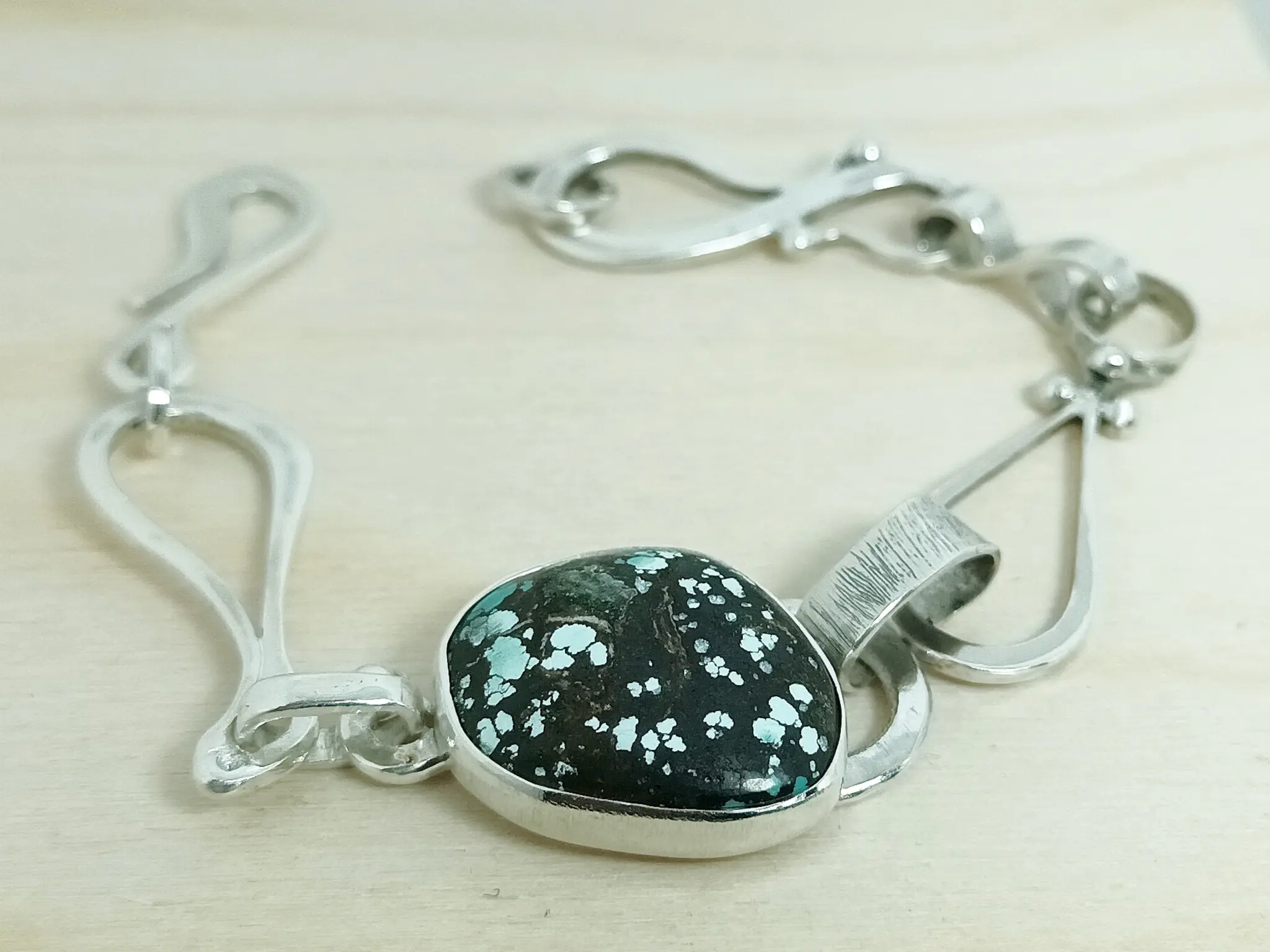 Front view of the Elsewhere contemporary sterling silver bracelet.