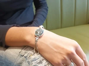 Elsewhere contemporary sterling silver bracelet worn on the hand.