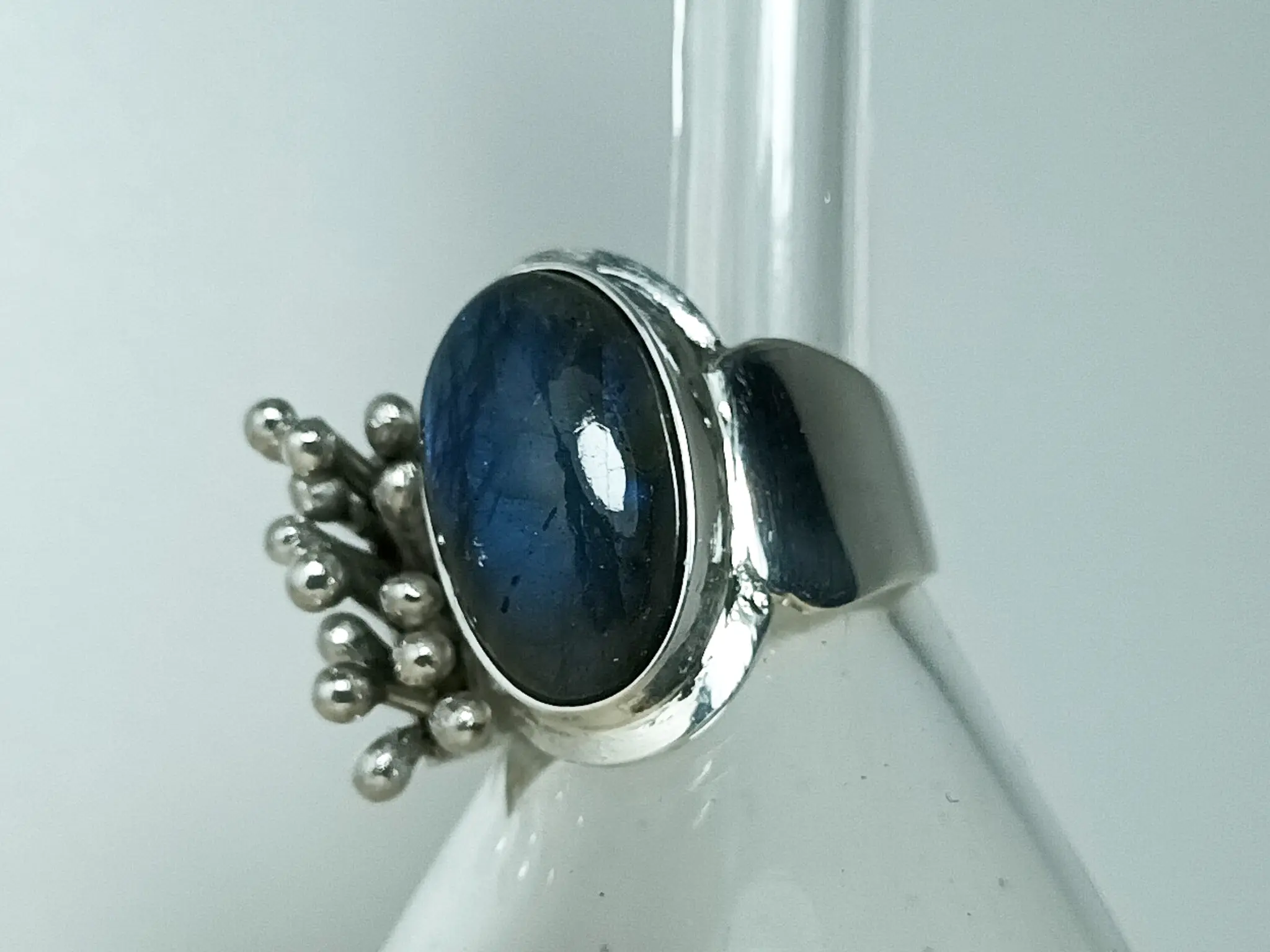 Angled view of Liminal handcrafted sterling silver ring with labradorite by MoodObjekt
