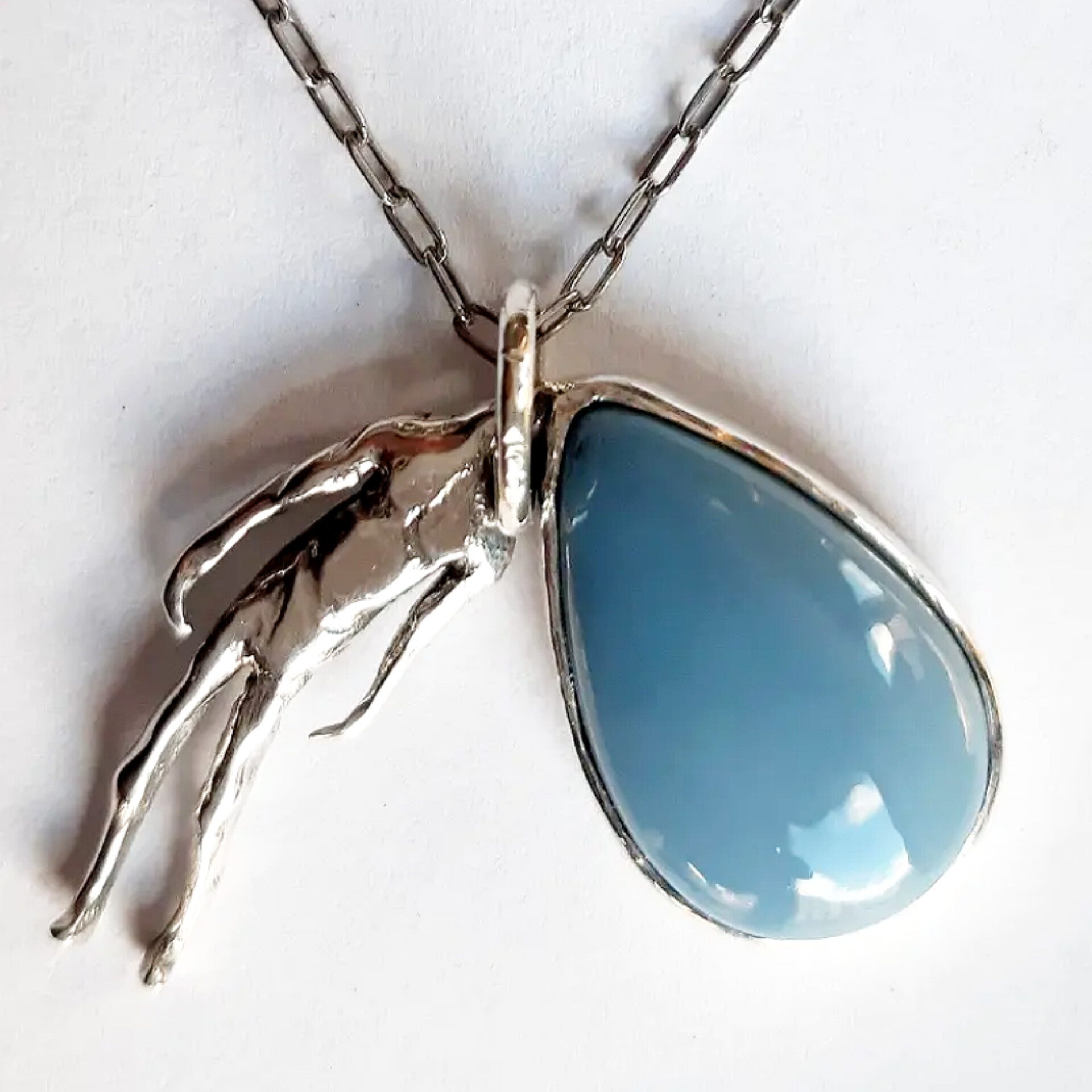 Overthinker sterling silver pendant with blue gemstone