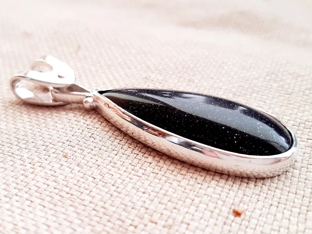 Nightfall sterling silver pendant with deep blue Goldstone – front angle 2