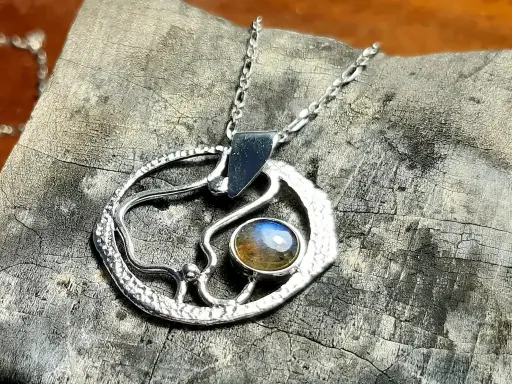 Tideline contemporary wearable sculpture handcrafted in silver with natural labradorite