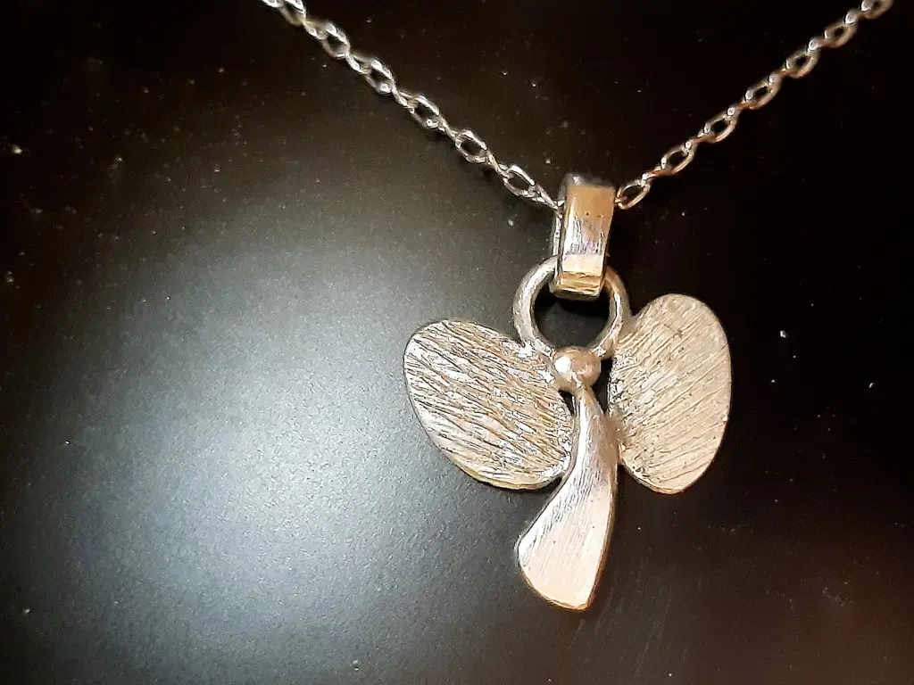 Shot from the Back sterling silver pendant – front