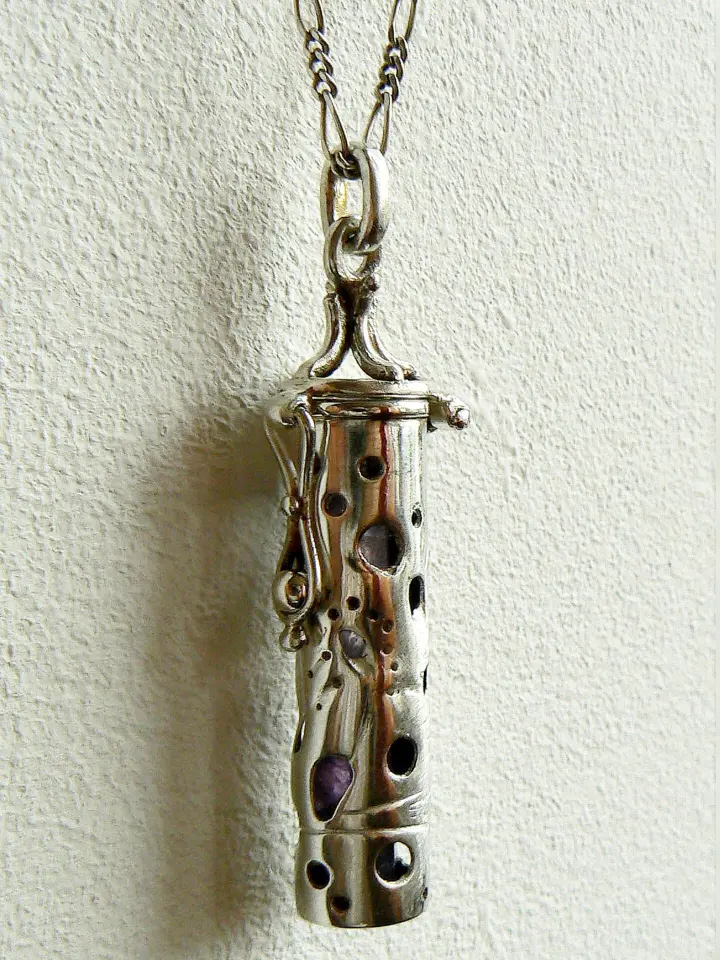 Dream Vessel sterling silver pendant with hidden amethyst gemstones – front