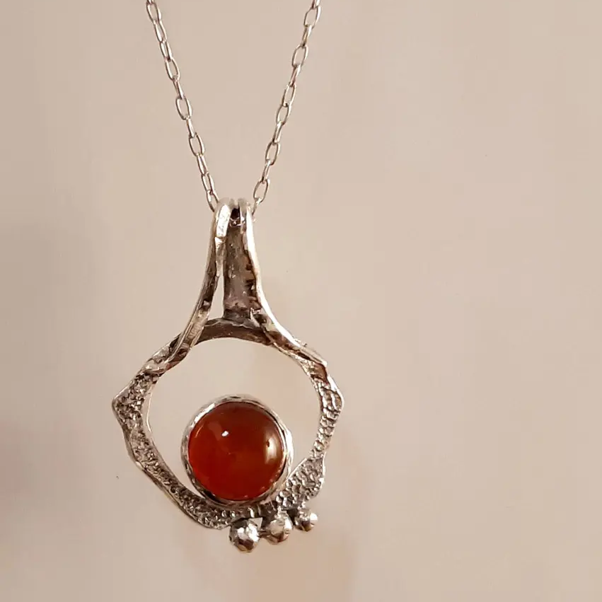 Ember contemporary wearable sculpture in 925 silver with natural carnelian