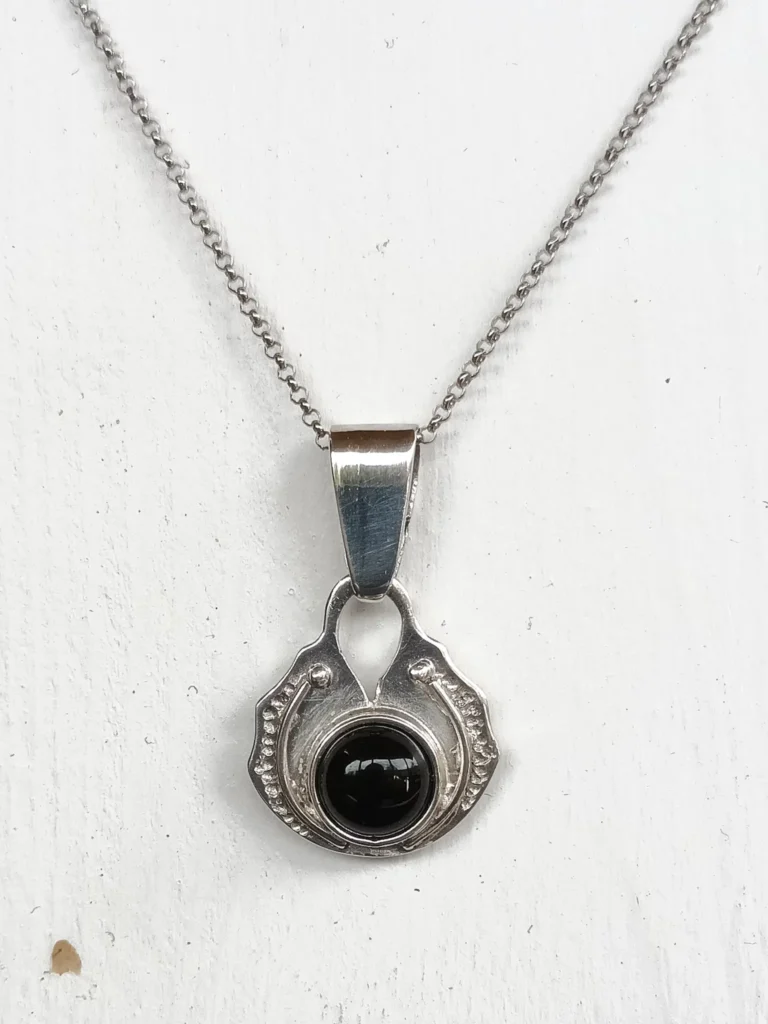 Witness sterling silver pendant with black onix – front